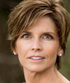 Headshot of reviewer Kathy T. showing woman with short brown hair and brown eyes looking into camera.